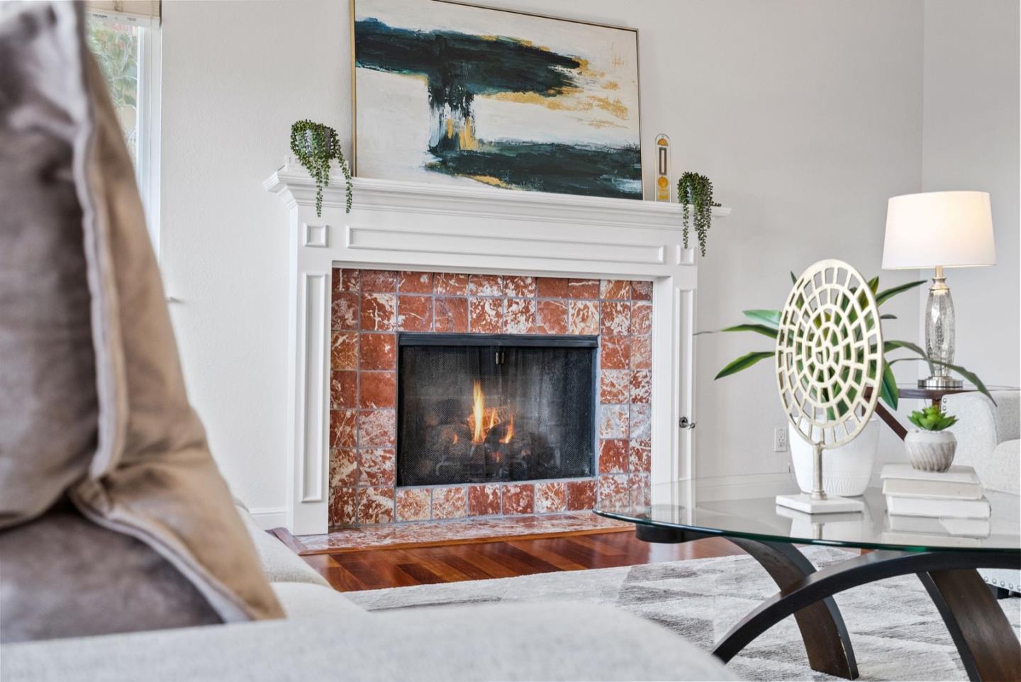 28 Cobblestone Lane Belmont, CA 94002 - Photo 19 of 45 a living room with furniture and a fireplace