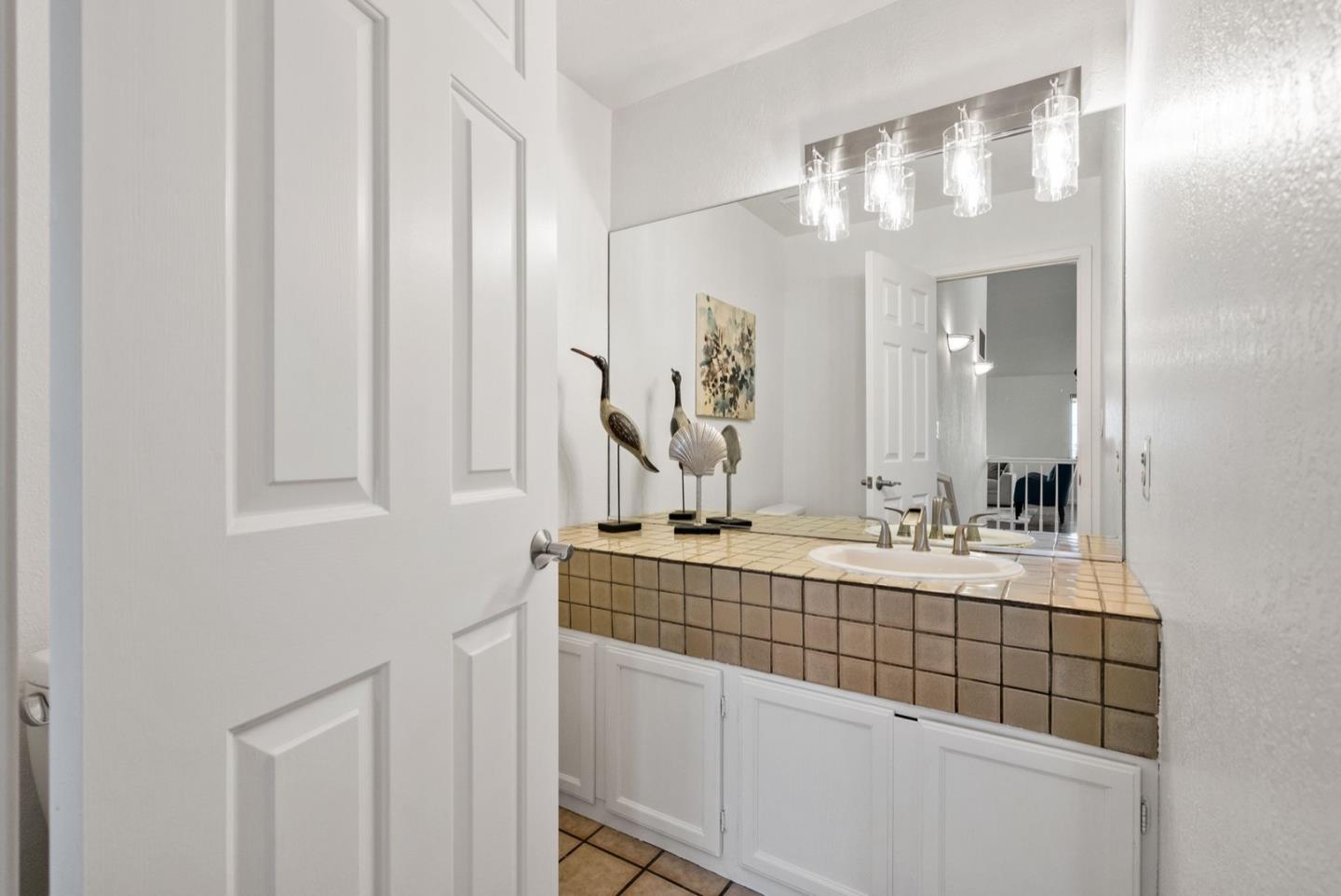 28 Cobblestone Lane Belmont, CA 94002 - Photo 21 of 45 a bathroom with a double vanity sink and mirror