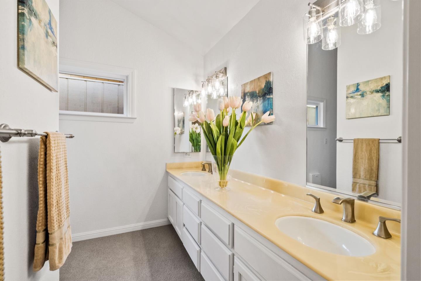 28 Cobblestone Lane Belmont, CA 94002 - Photo 27 of 45 a bathroom with a double vanity sink and a mirror