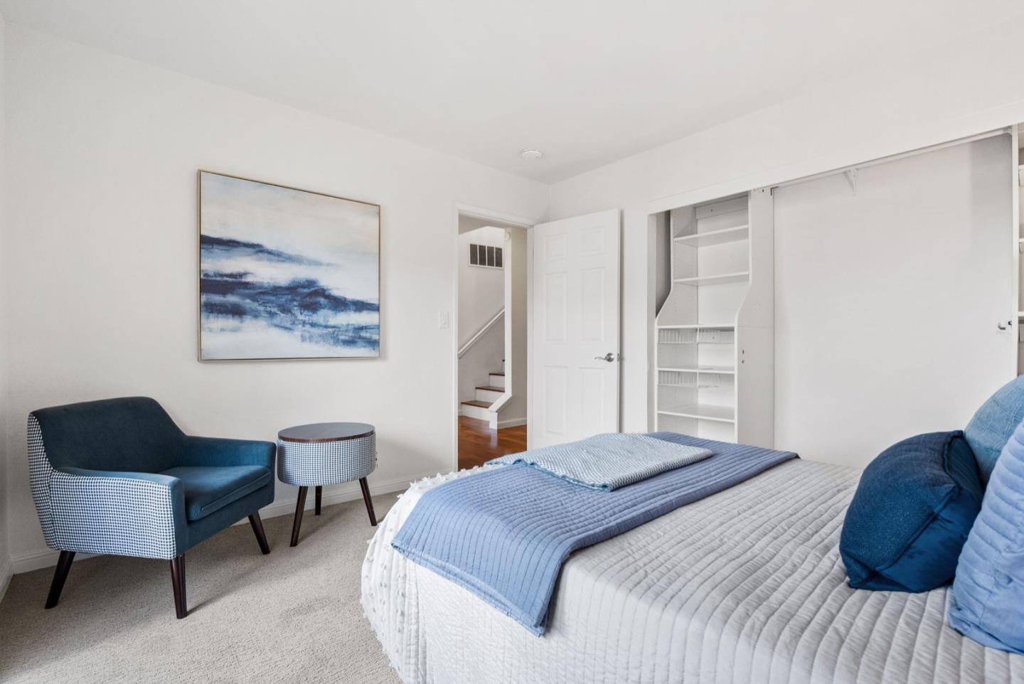 28 Cobblestone Lane Belmont, CA 94002 - Photo 31 of 45 a bedroom with a bed and a chair