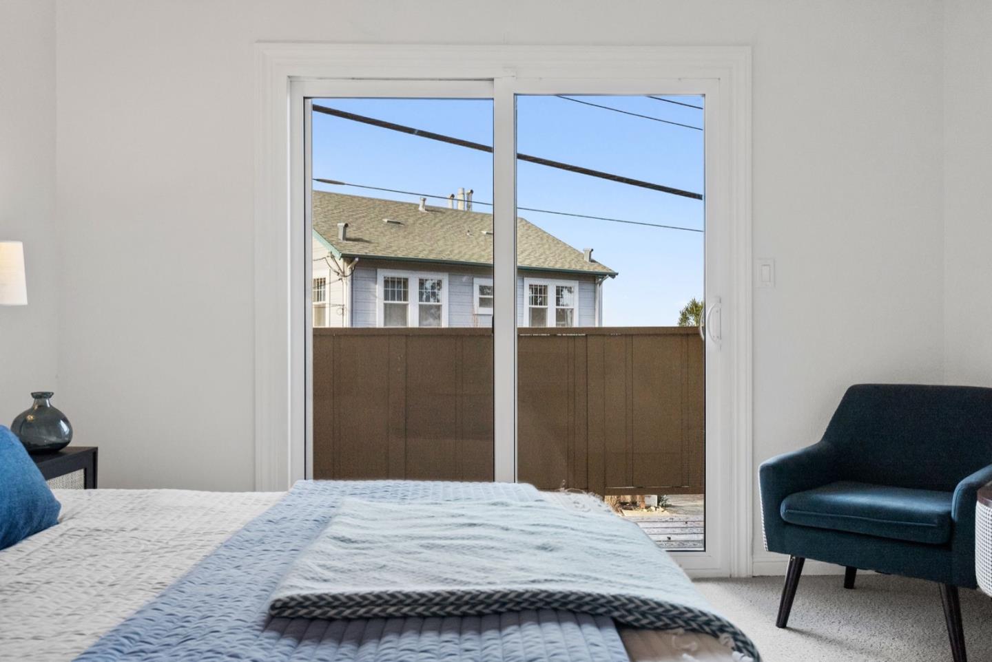 28 Cobblestone Lane Belmont, CA 94002 - Photo 32 of 45 a bedroom with a bed and a chair