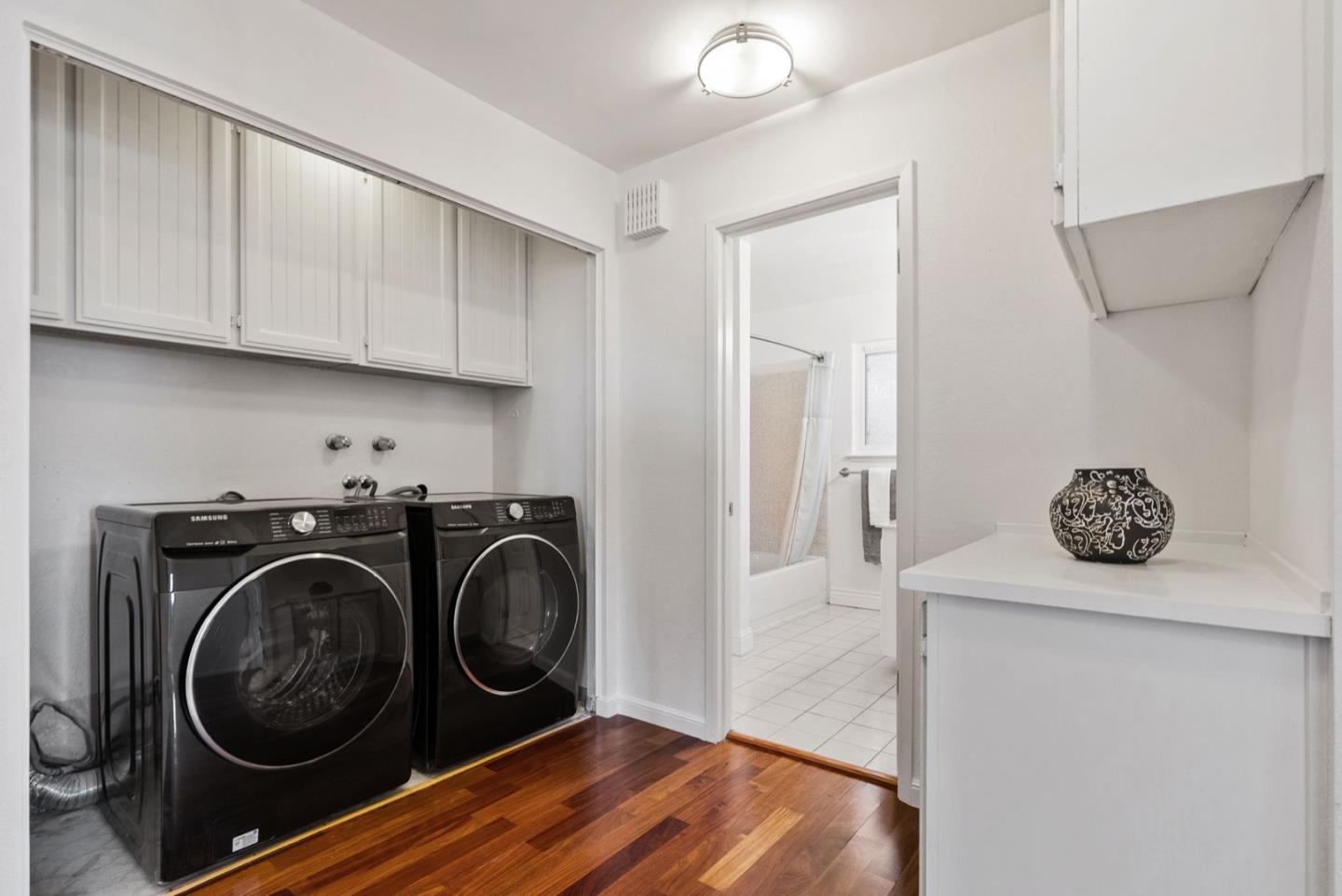 28 Cobblestone Lane Belmont, CA 94002 - Photo 36 of 45 a utility room with sink dryer and washer