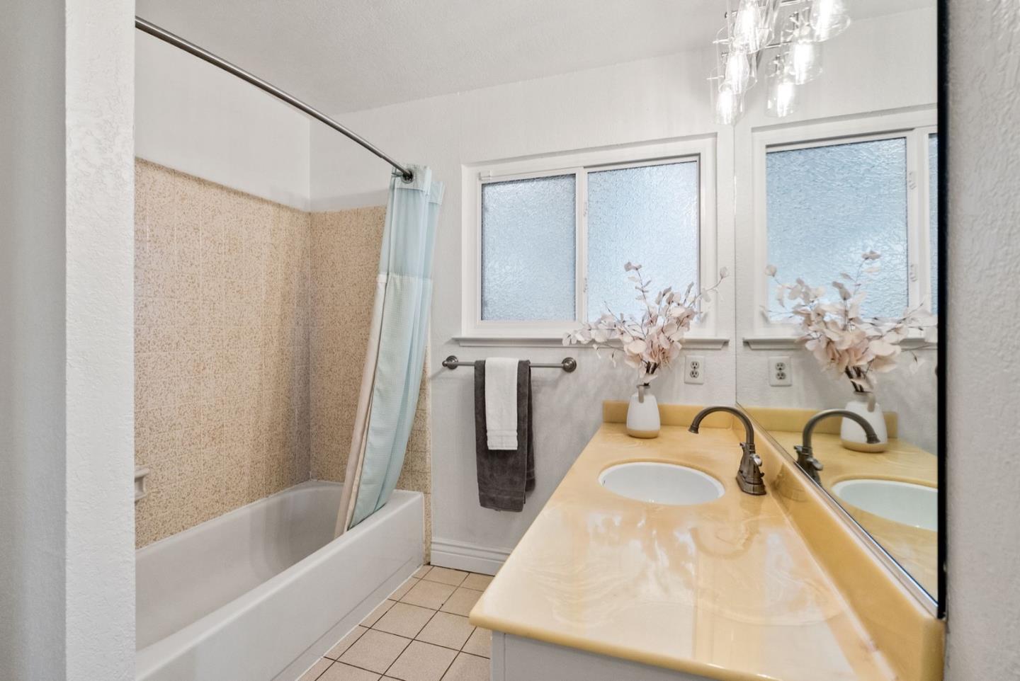 28 Cobblestone Lane Belmont, CA 94002 - Photo 37 of 45 a bath tub sitting next to a bathroom sink