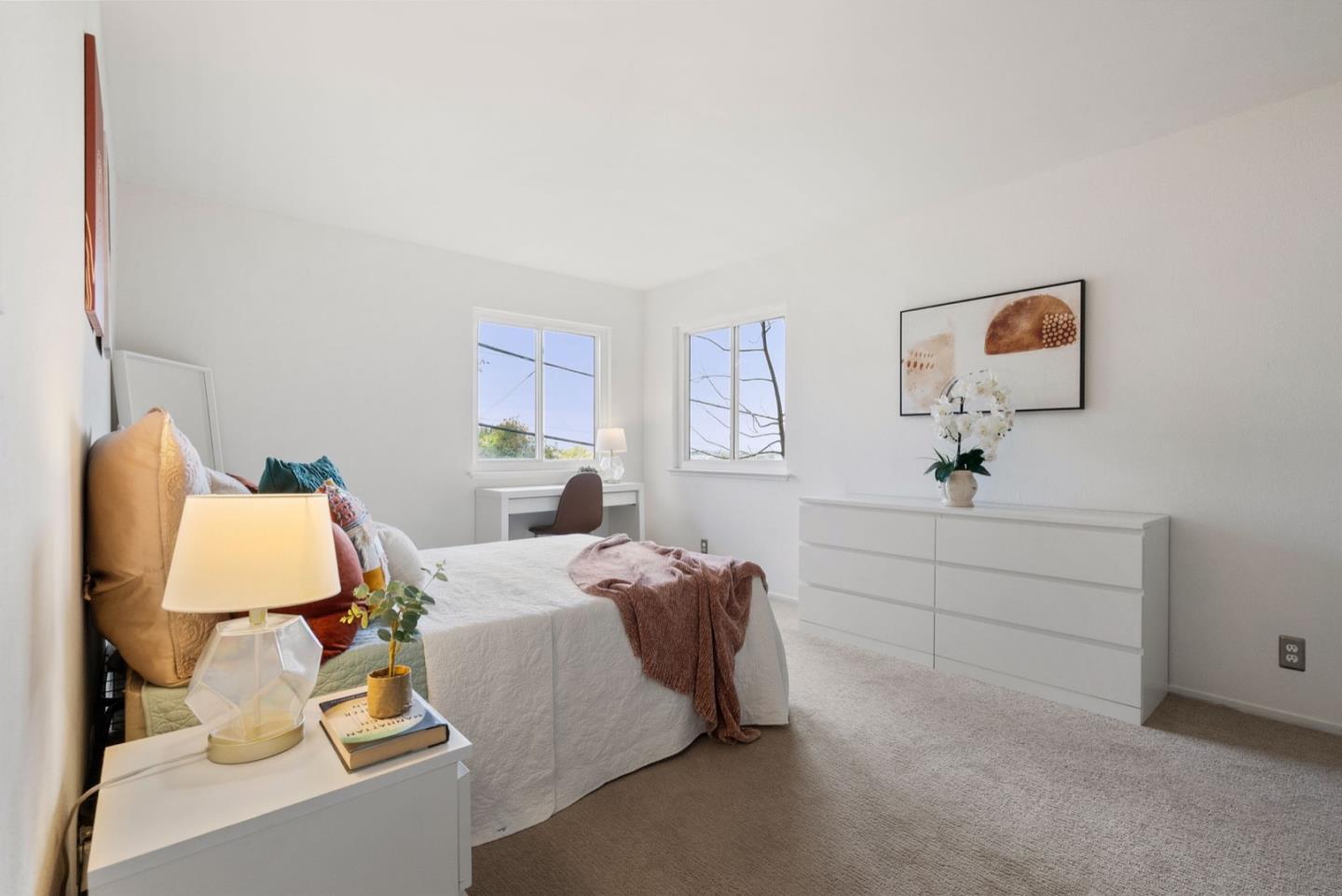 28 Cobblestone Lane Belmont, CA 94002 - Photo 38 of 45 a bedroom with a bed and a lamp on dresser