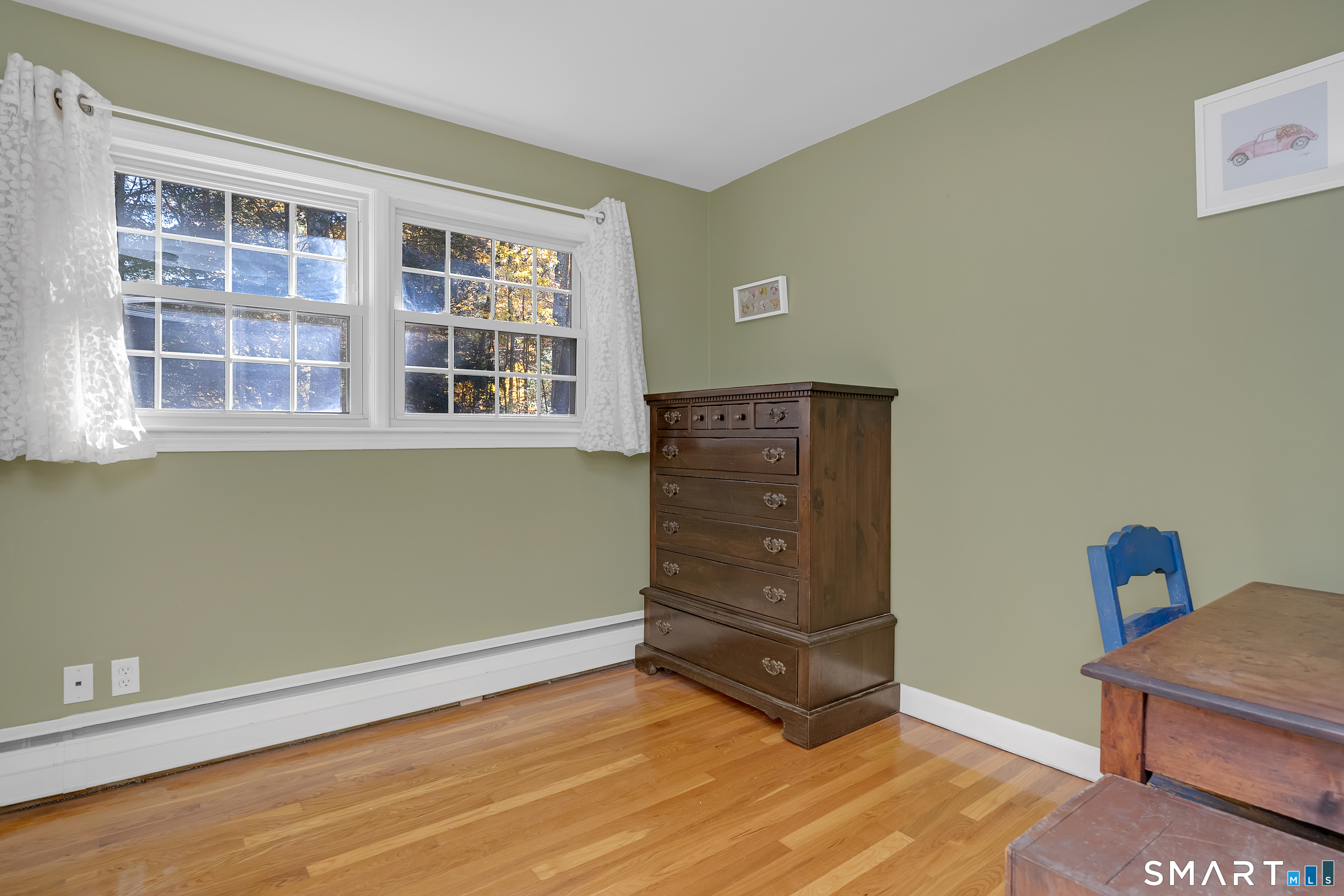 16 Marion Road Bethany, CT 06524 - Photo 26 of 40 a view of an empty room with wooden floor and a window