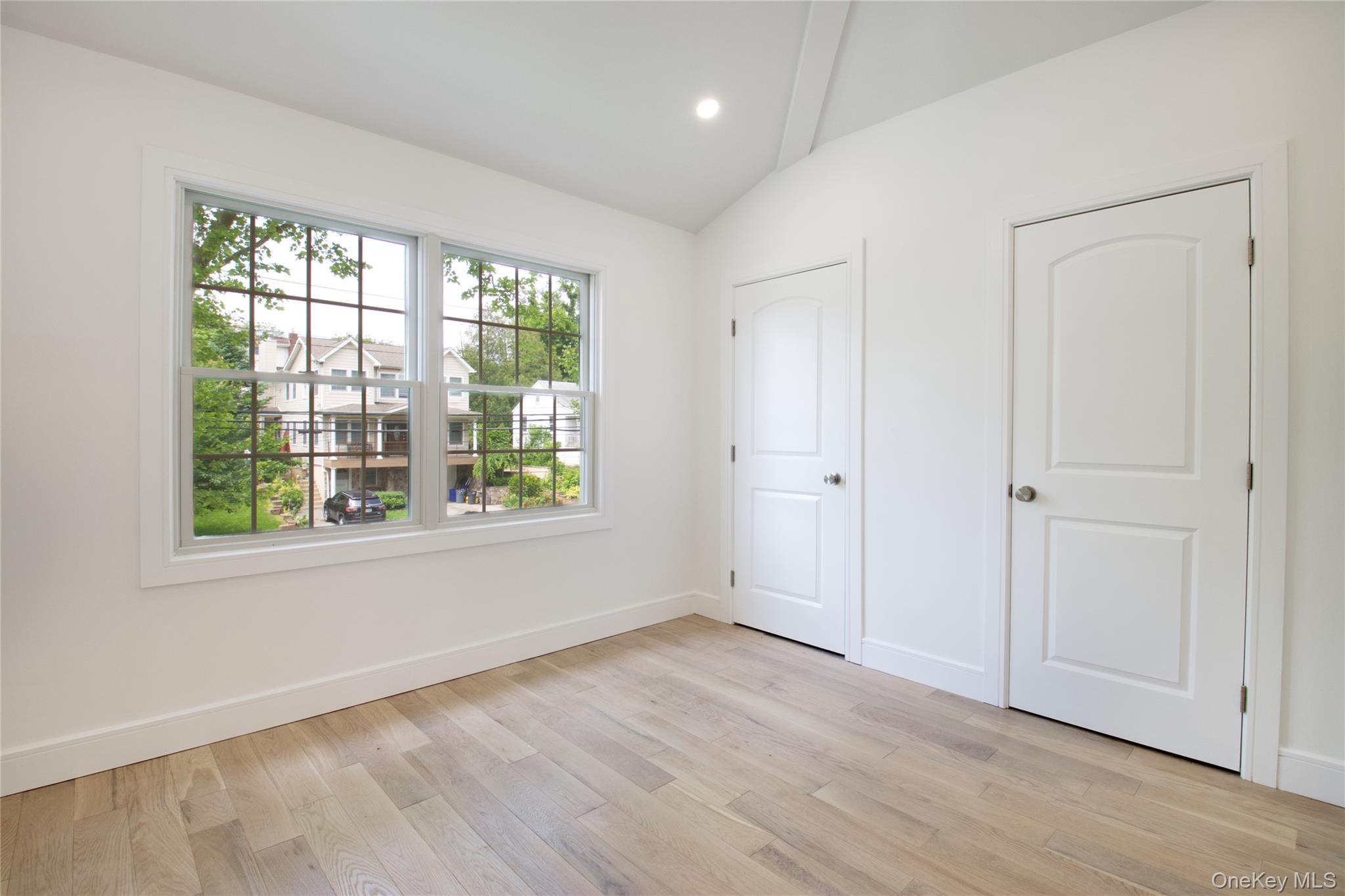 30 Kirkwood Road, Unit B Port Washington, NY 11050 - Photo 22 of 36 a view of an empty room with wooden floor and a window