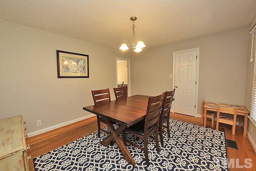 7210 Kemp Road Raleigh, NC 27613 - Photo 5 of 20 a view of a dining room with furniture