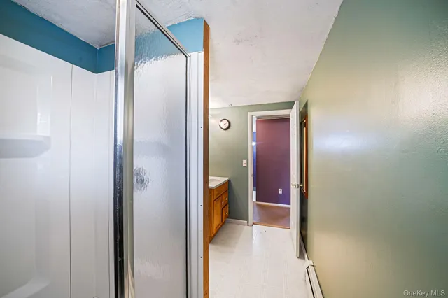 a view of a bathroom from a hallway