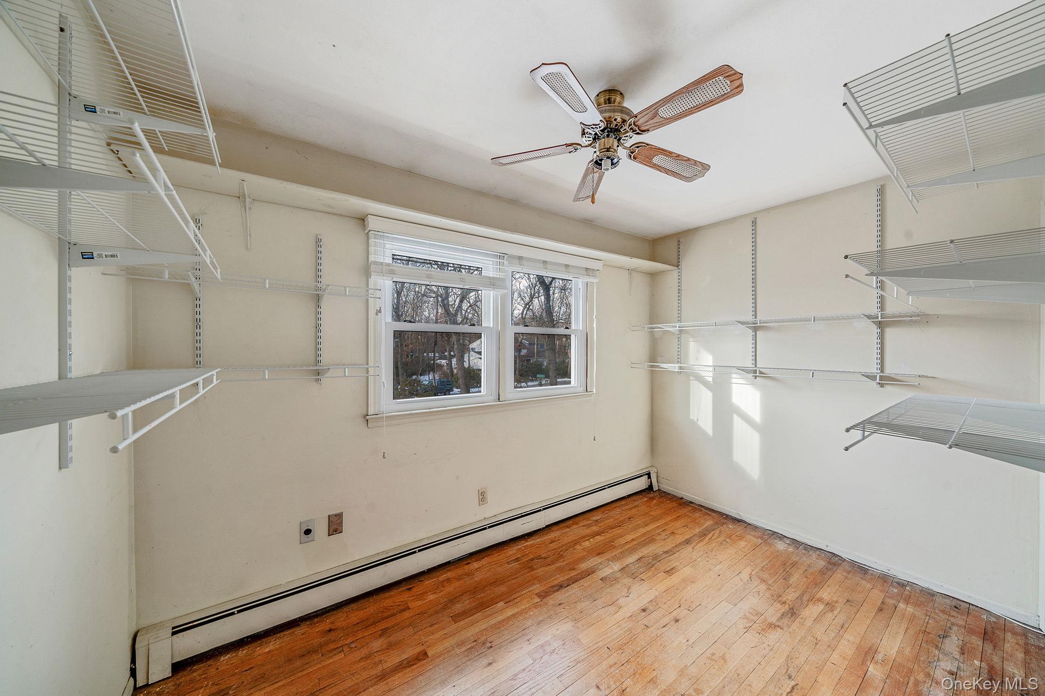 120 Rustic Road Port Jefferson, NY 11777 - Photo 32 of 45 a view of a room with window and ceiling fan
