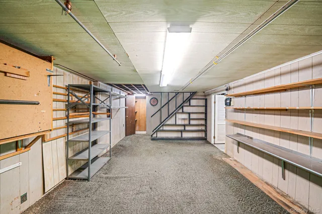a view of an empty room with stairs