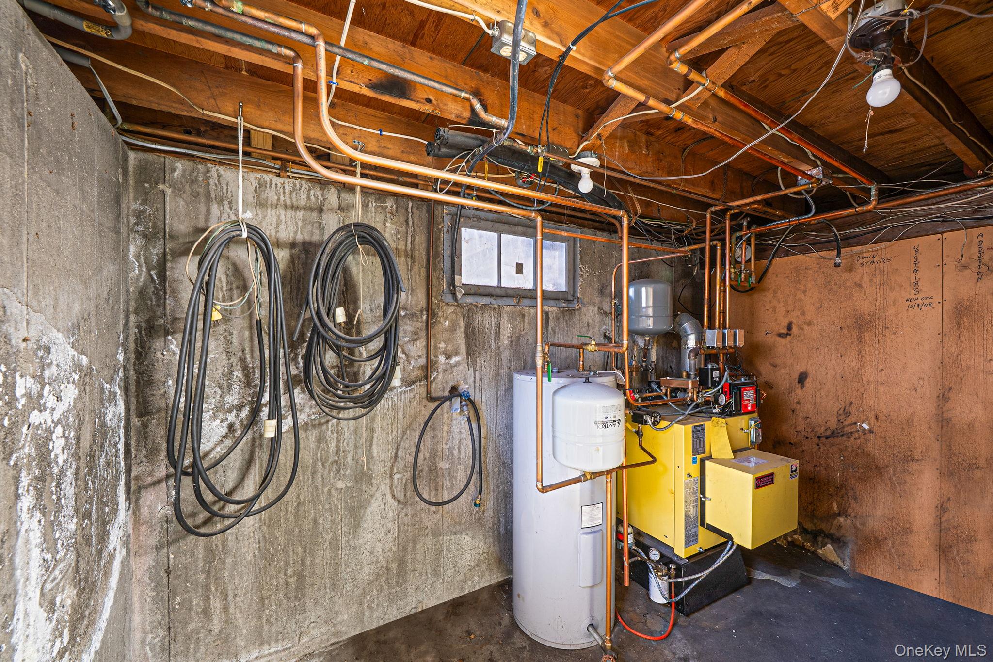 120 Rustic Road Port Jefferson, NY 11777 - Photo 45 of 45 Unfinished basement featuring water heater and a heating unit