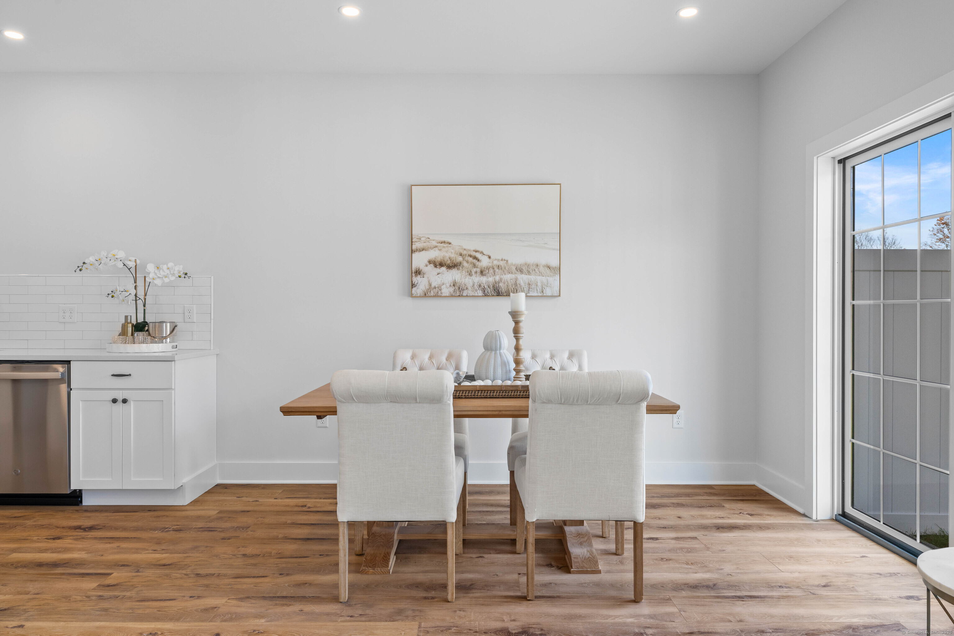 138 Boston Post Road, Unit 16 East Lyme, CT 06333 - Photo 12 of 35 a view of a dining room with furniture and wooden floor