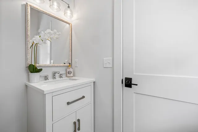 a bathroom with a sink and a mirror