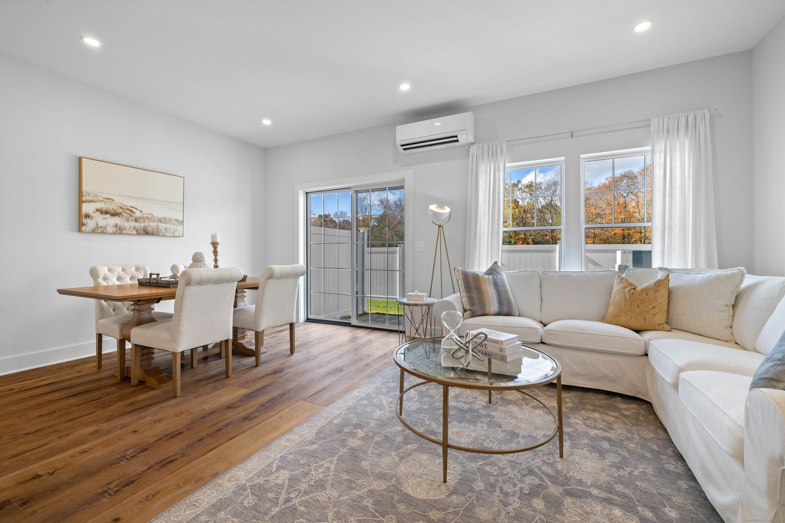 138 Boston Post Road, Unit 16 East Lyme, CT 06333 - Photo 2 of 35 a living room with furniture and a large window