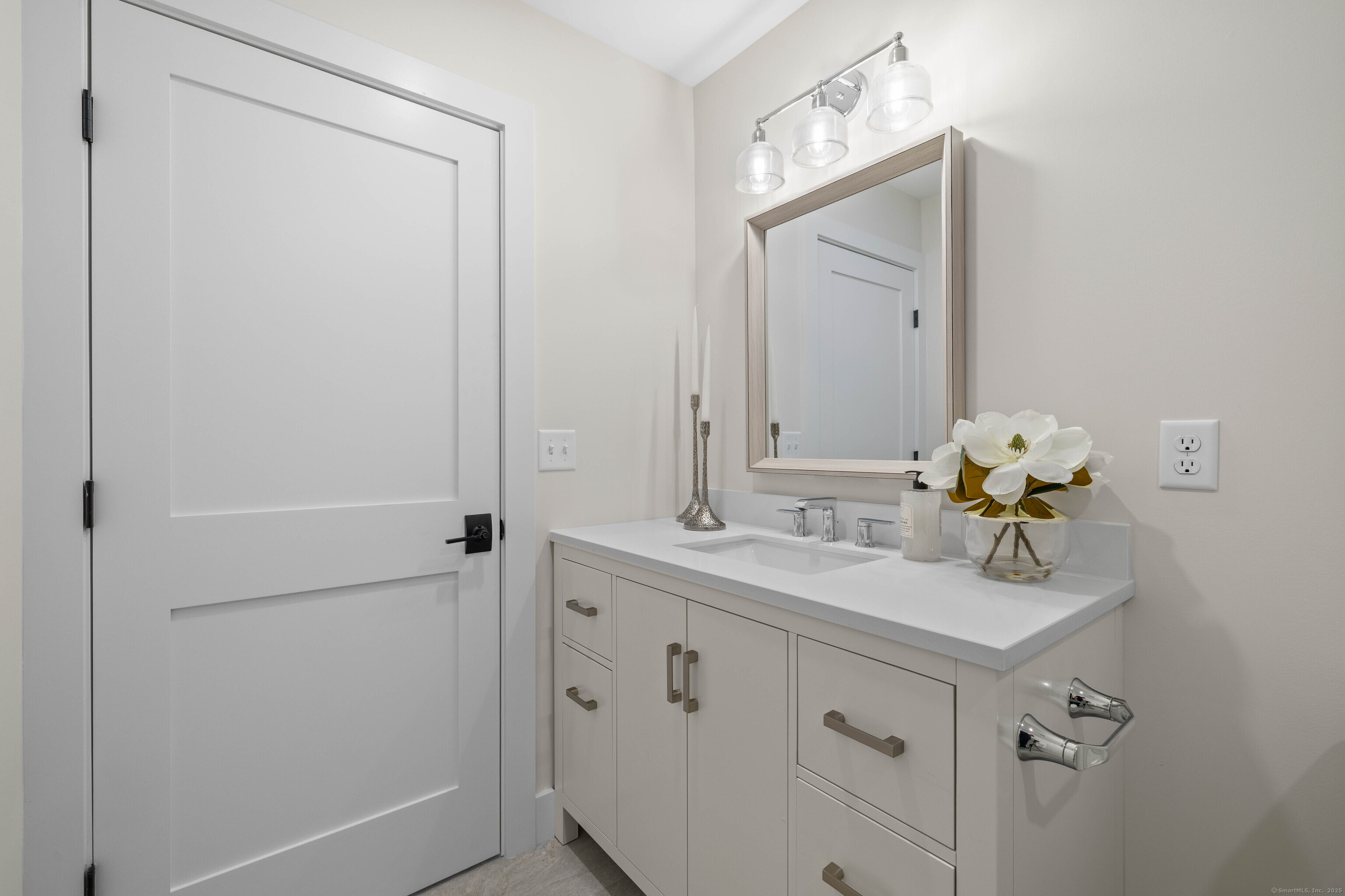 138 Boston Post Road, Unit 16 East Lyme, CT 06333 - Photo 22 of 35 a bathroom with a sink a mirror and a shower