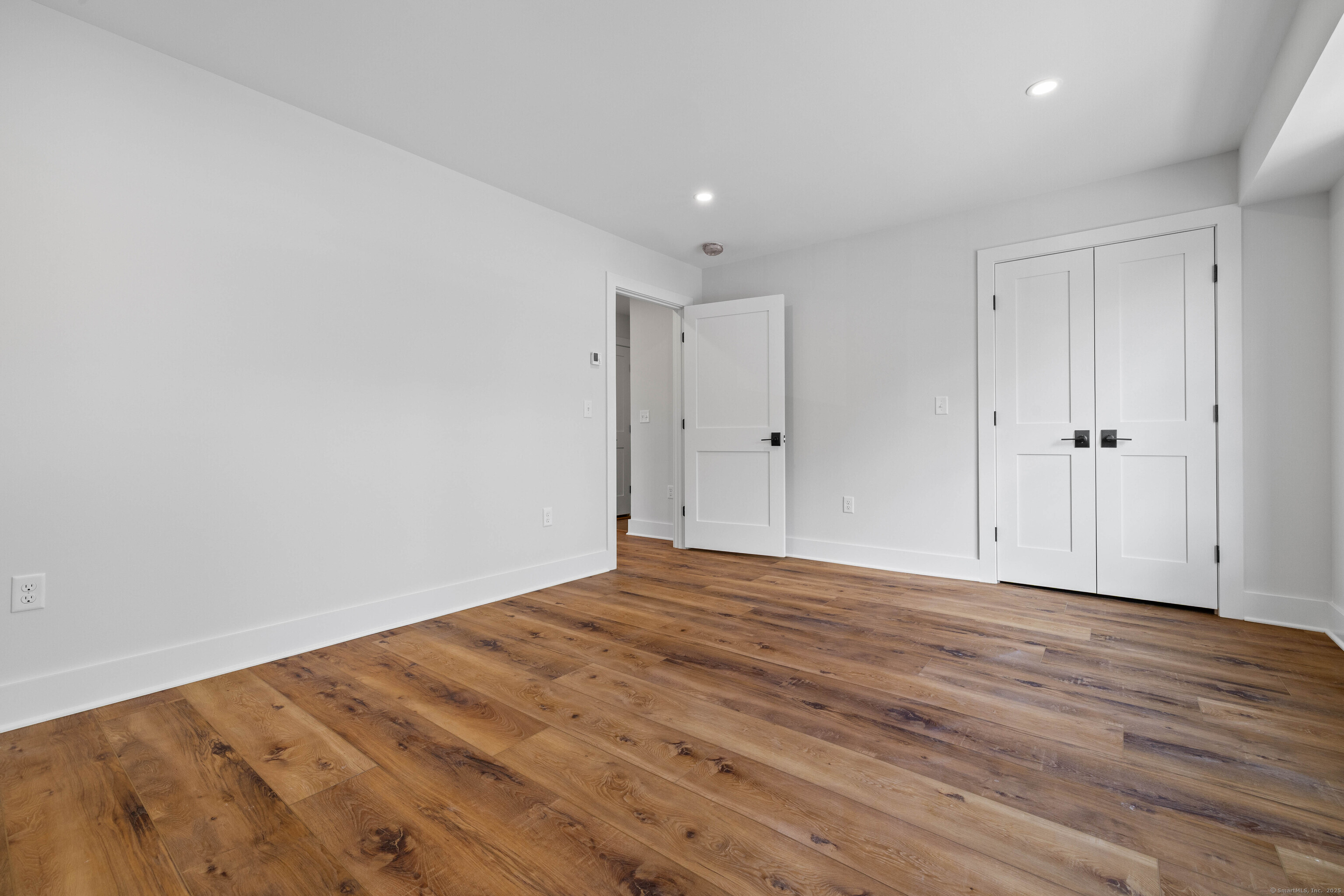 138 Boston Post Road, Unit 16 East Lyme, CT 06333 - Photo 24 of 35 a view of empty room with wooden floor