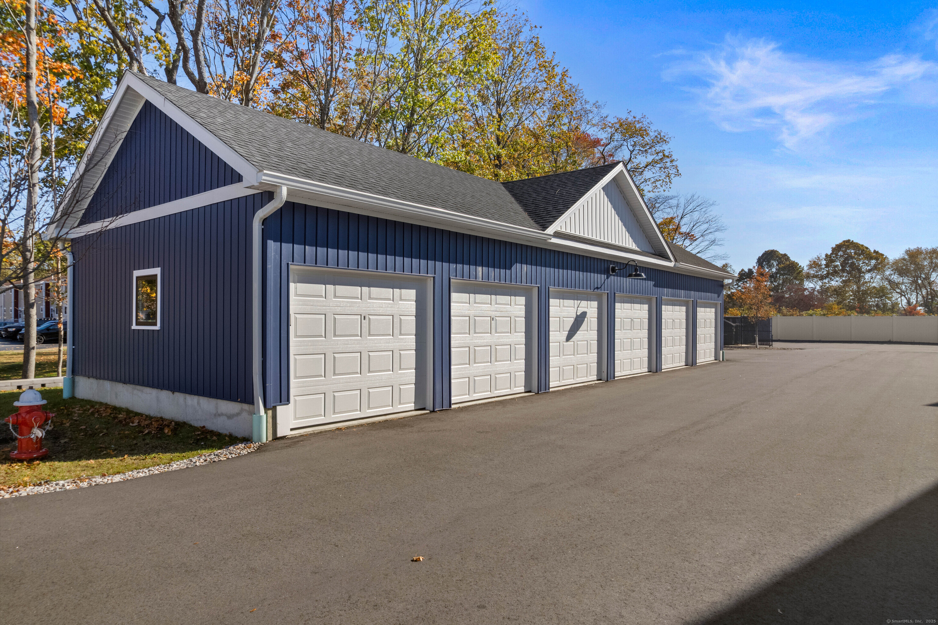 138 Boston Post Road, Unit 16 East Lyme, CT 06333 - Photo 32 of 35 a view of an house with backyard and deck