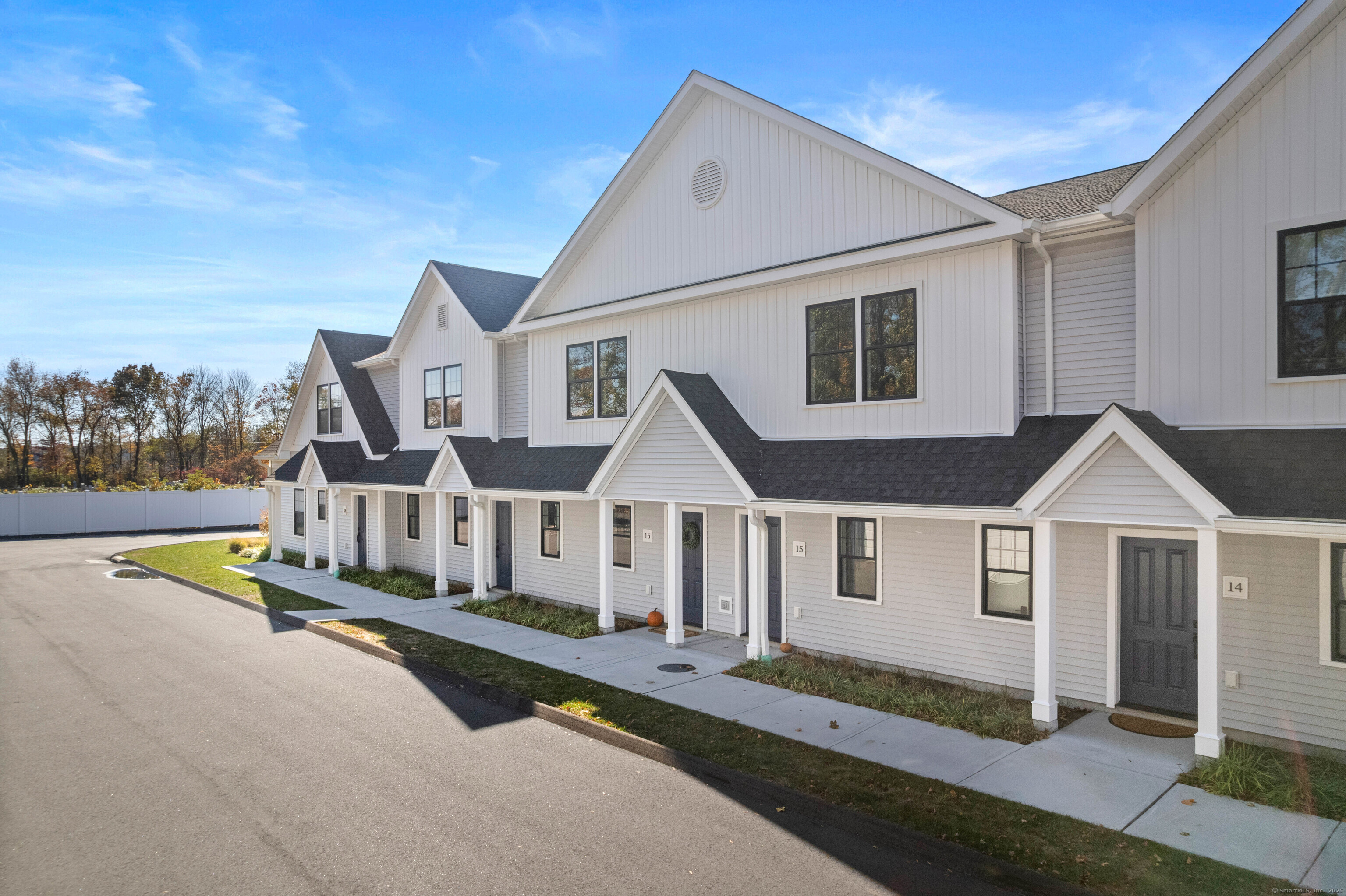 138 Boston Post Road, Unit 16 East Lyme, CT 06333 - Photo 34 of 35 a front view of a house with a yard