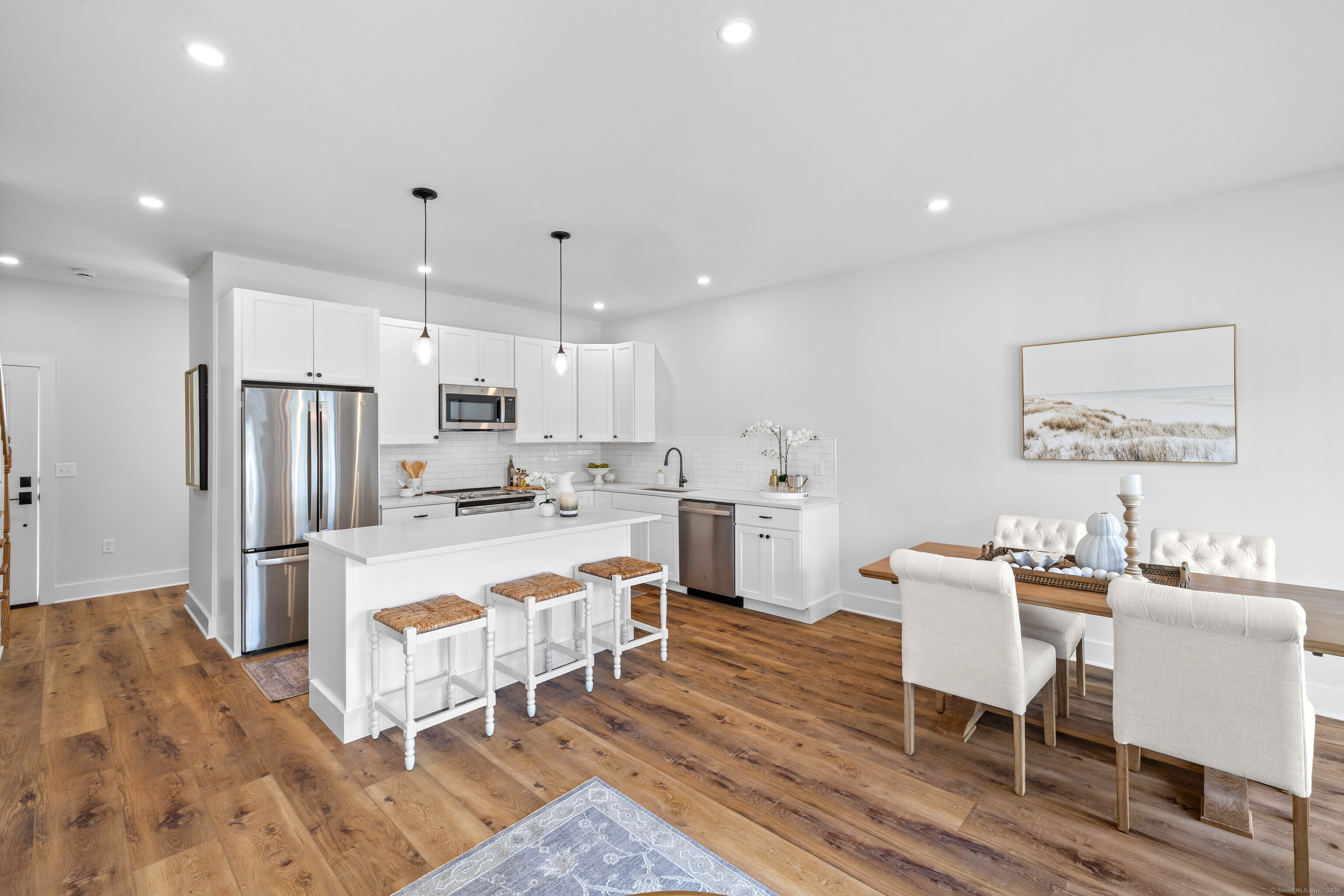 138 Boston Post Road, Unit 16 East Lyme, CT 06333 - Photo 4 of 35 a large kitchen with a table and chairs