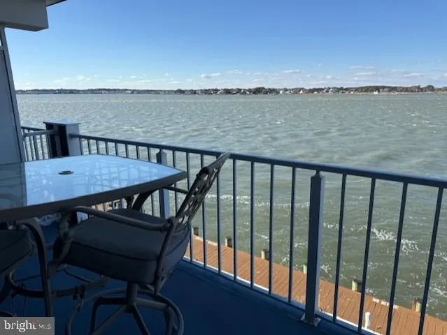 a view of a balcony with furniture