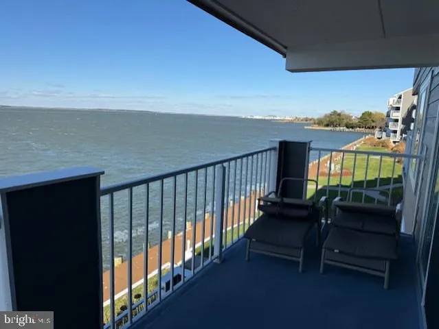 a view of balcony with furniture