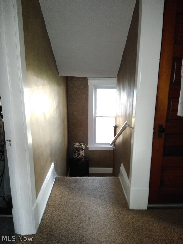 12 East Schaaf Road Independence, OH 44131 - Photo 21 of 33 Stairway up to the Up Stairs Center Hall...To the right is the door to the 3rd floor