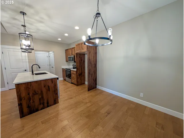 a view of a kitchen with a sink and dishwasher