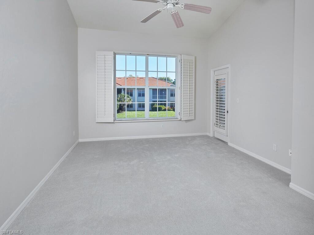 1033 Egrets Walk Circle, Unit 203 Naples, FL 34108 - Photo 20 of 35 an empty room with a window
