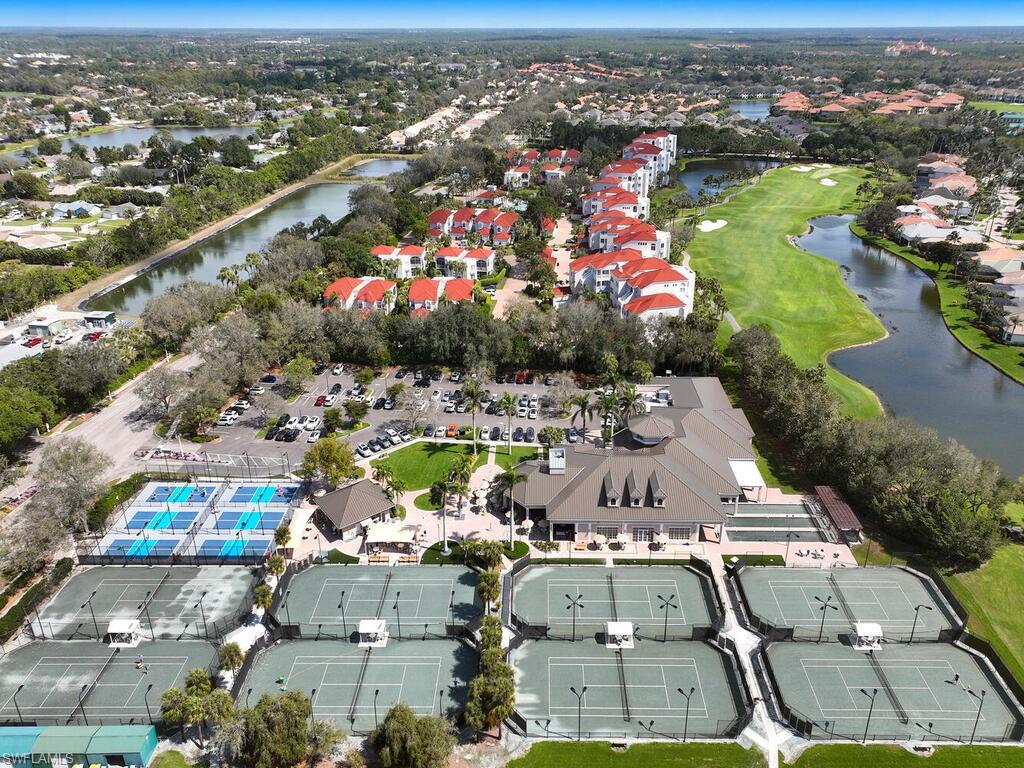1033 Egrets Walk Circle, Unit 203 Naples, FL 34108 - Photo 29 of 35 an aerial view of residential houses with outdoor space