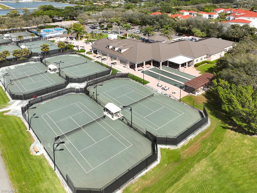 1033 Egrets Walk Circle, Unit 203 Naples, FL 34108 - Photo 30 of 35 an aerial view of a residential houses with outdoor space and swimming pool