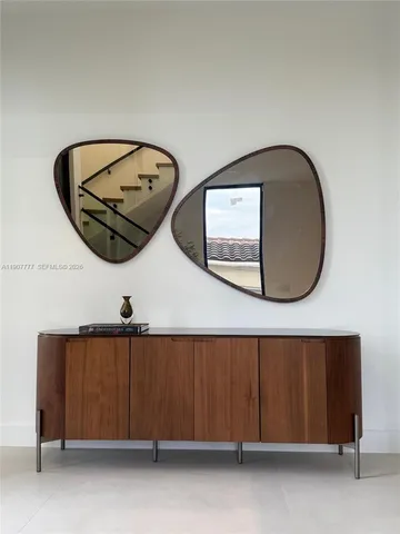 a bathroom with a shower sink and mirror