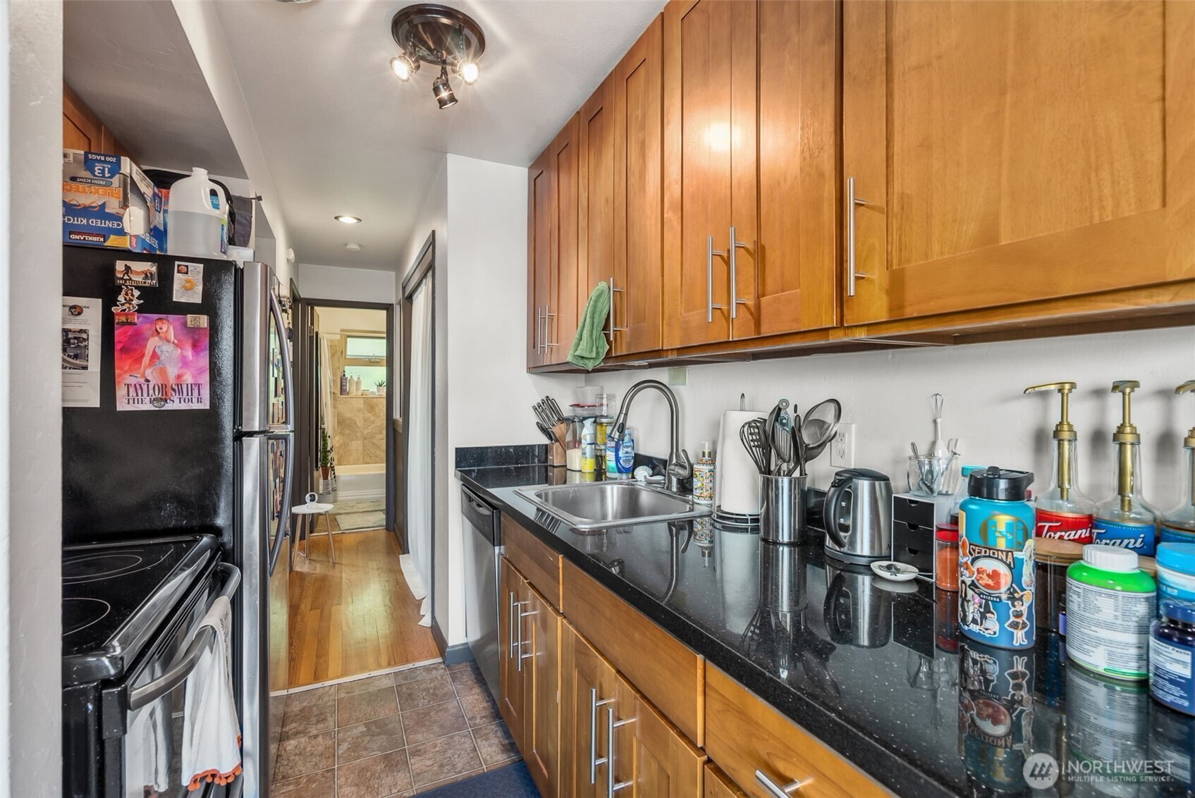 2350 Beacon Avenue South Seattle, WA 98144 - Photo 20 of 23 a kitchen with lots of clutter and stainless steel appliances