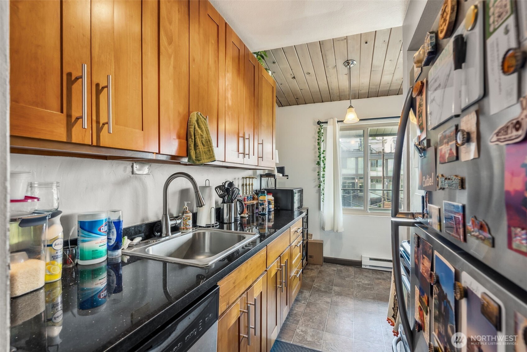2350 Beacon Avenue South Seattle, WA 98144 - Photo 23 of 23 a kitchen with stainless steel appliances granite countertop a sink a stove and a wooden cabinets