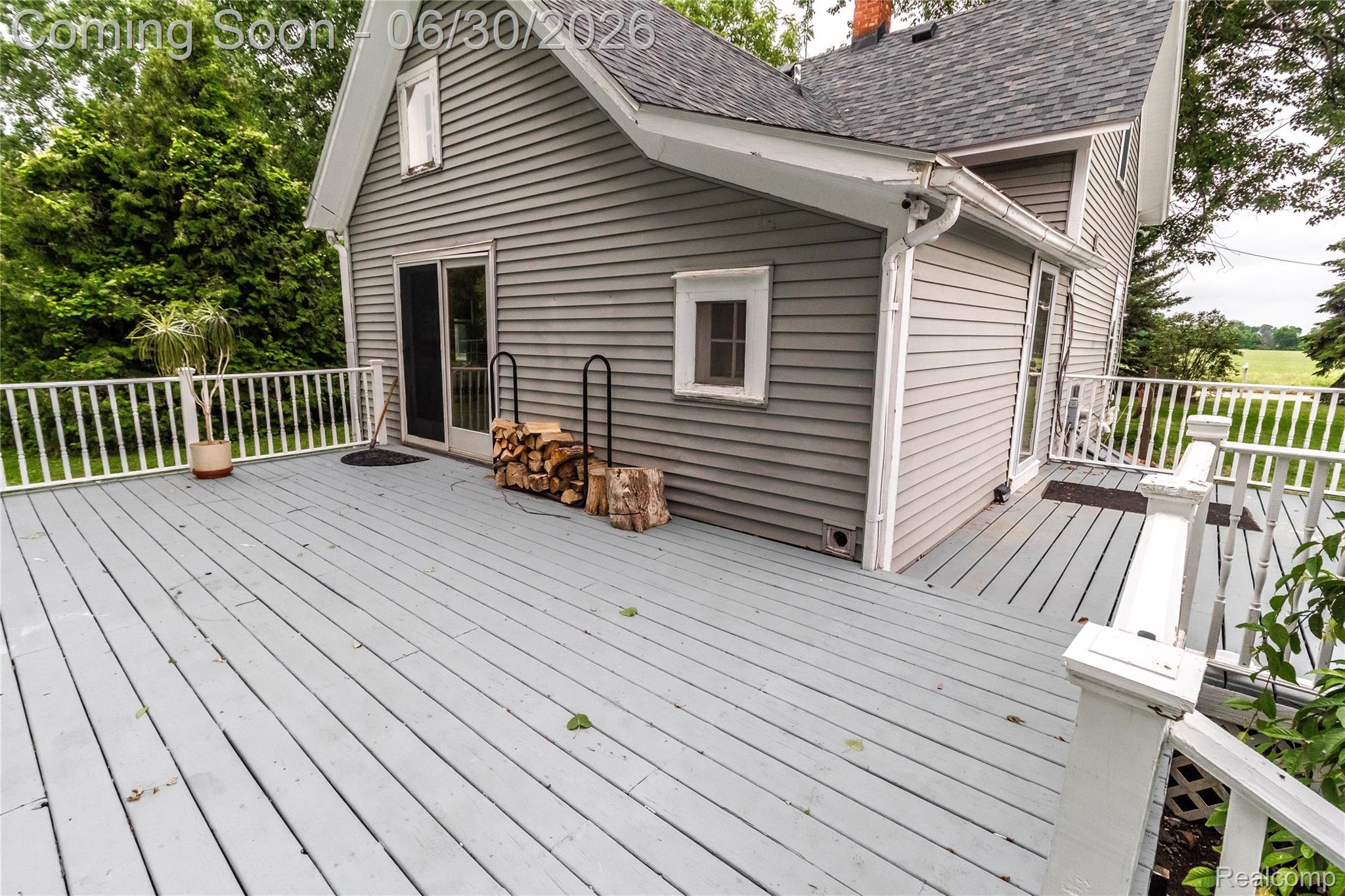 8150 Norman Road Imlay City, MI 48444 - Photo 3 of 58 Expansive outdoor deck with painted wood flooring and white railing