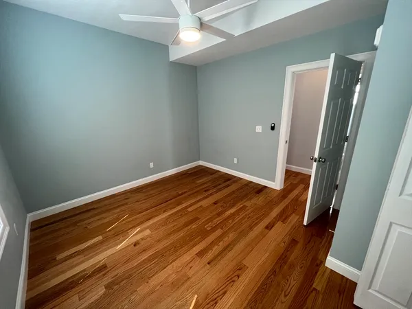 a view of a room with wooden floor and staircase