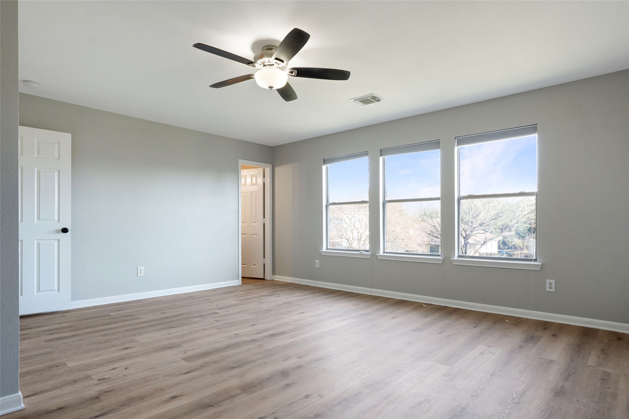 3630 Avalon Castle Drive Spring, TX 77386 - Photo 23 of 39 an empty room with wooden floor and windows