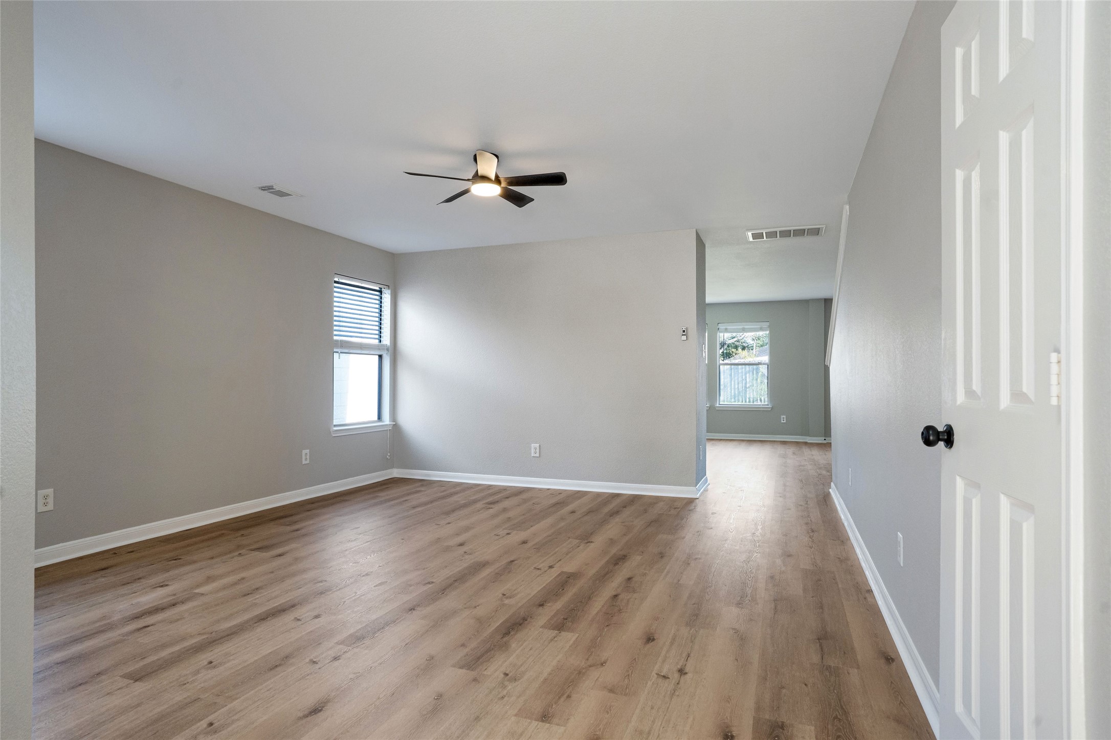 3630 Avalon Castle Drive Spring, TX 77386 - Photo 3 of 39 a view of empty room with wooden floor and fan