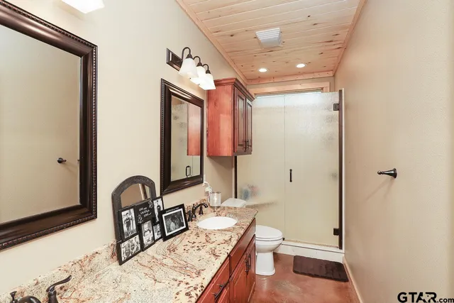 a bedroom with bed and a tv