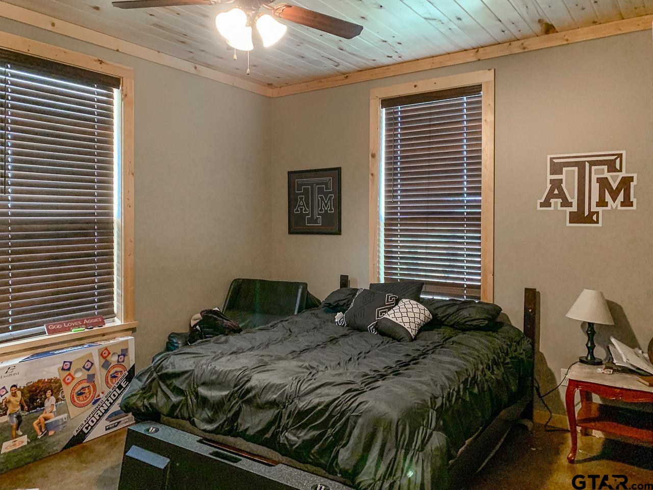 4450 Southwest County Road 3010 Mount Vernon, TX 75457 - Photo 14 of 39 a bedroom with a bed and a window