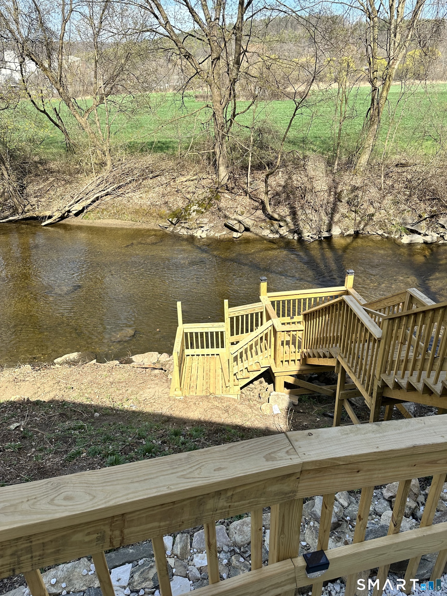 15 Lower Road North Canaan, CT 06018 - Photo 3 of 36 a view of a lake with a wooden deck