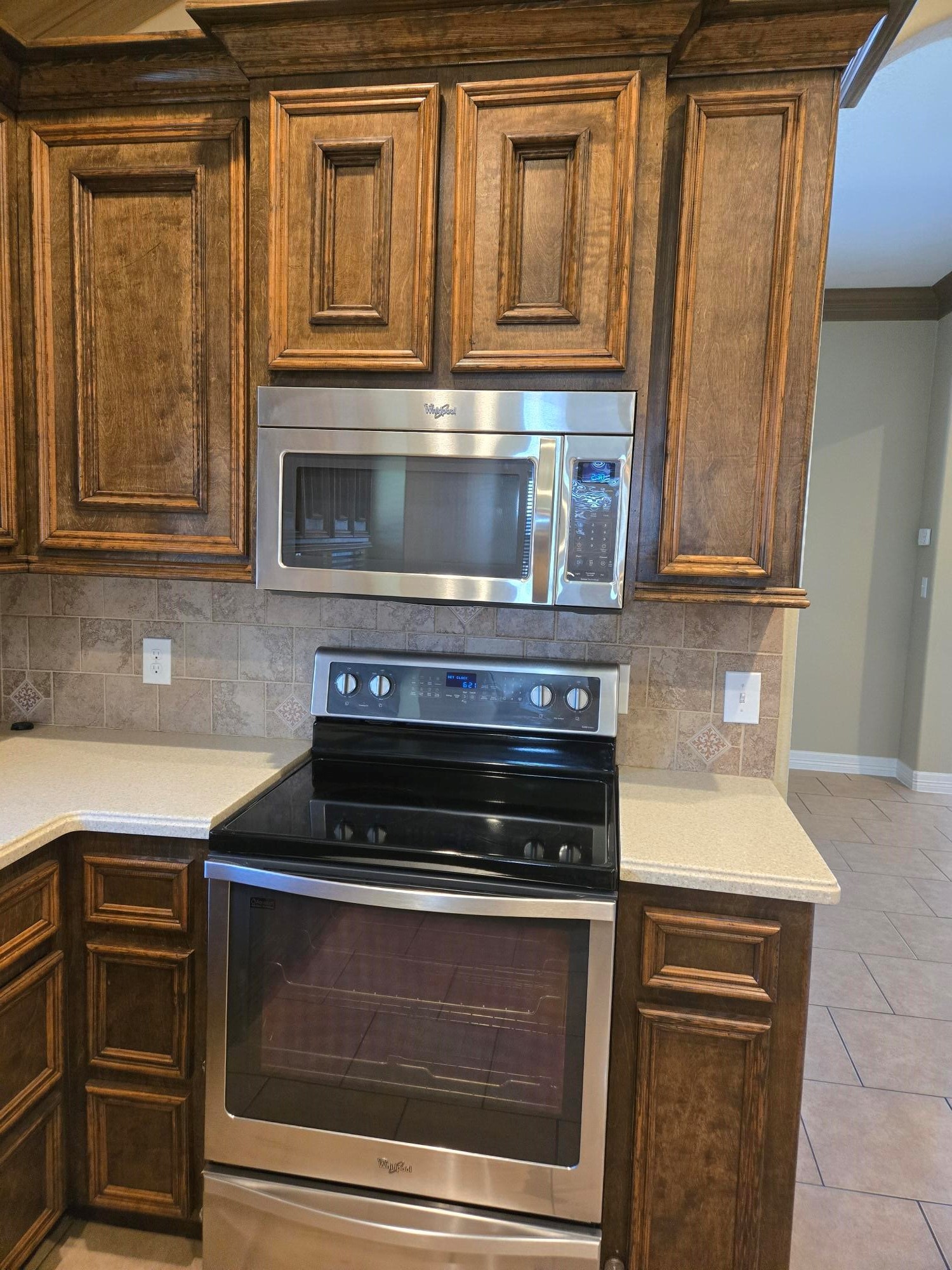 306 Masterson Street Arcola, TX 77583 - Photo 9 of 28 a kitchen with granite countertop cabinets stainless steel appliances and wooden floor