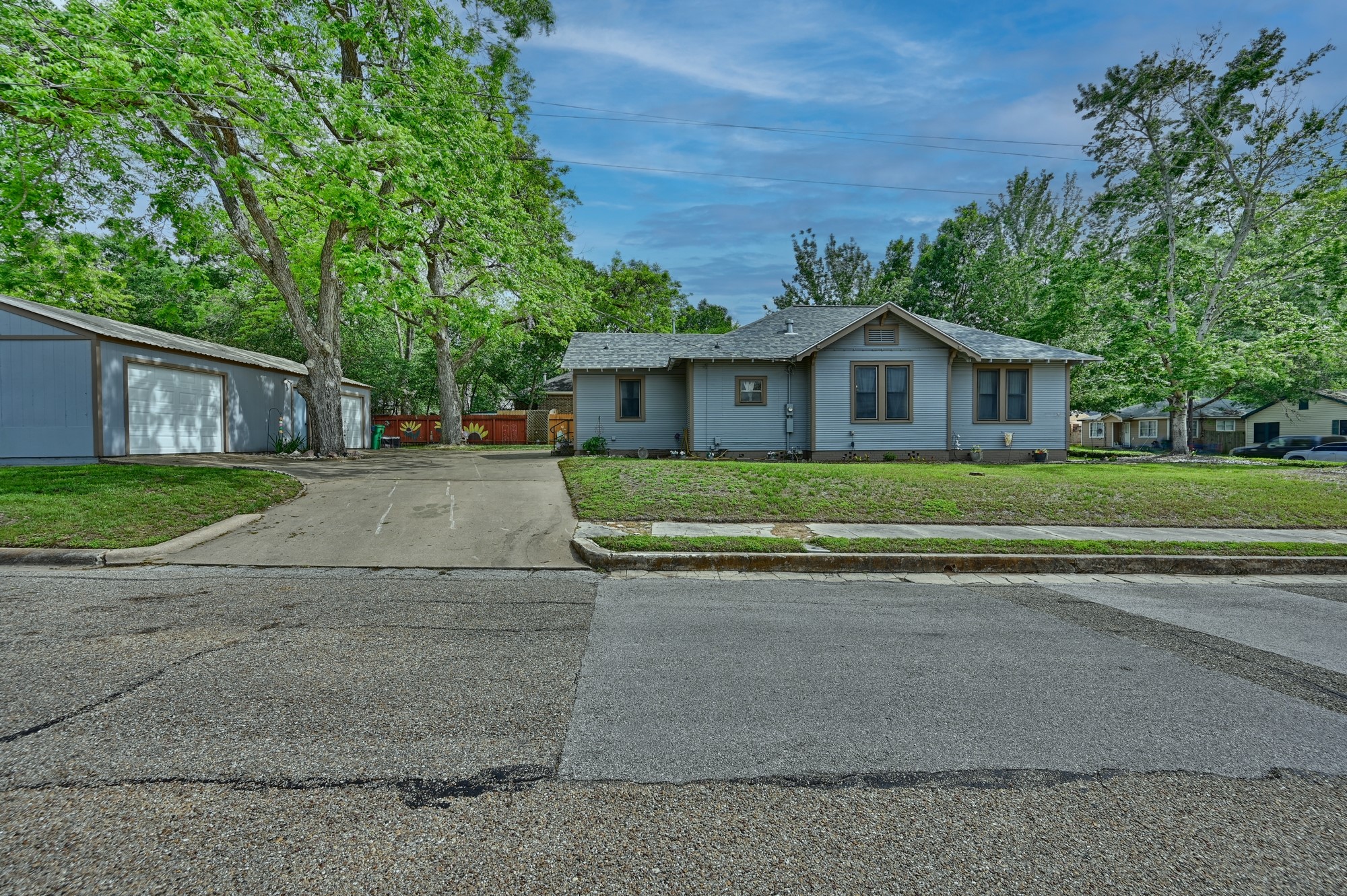 1501 South Austin Street Brenham, TX 77833 - Photo 33 of 36 a front view of a house with a garden