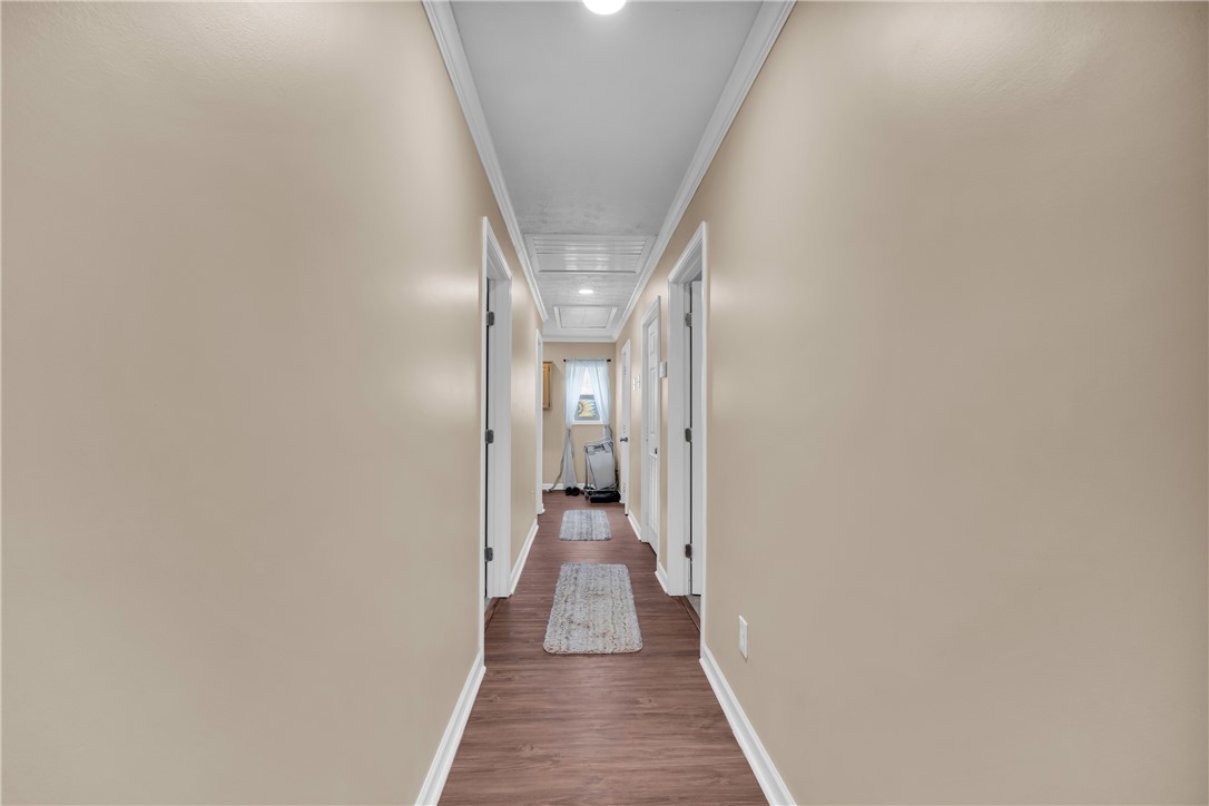 3030 Smith McGee Road Iva, SC 29655 - Photo 26 of 46 A well-lit corridor welcomes you home with durable laminate flooring and crisp white trim.