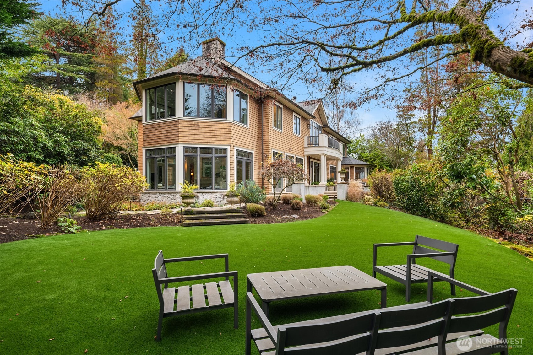 3814 East John Street Seattle, WA 98112 - Photo 3 of 28 a view of a house with a yard deck and a slide