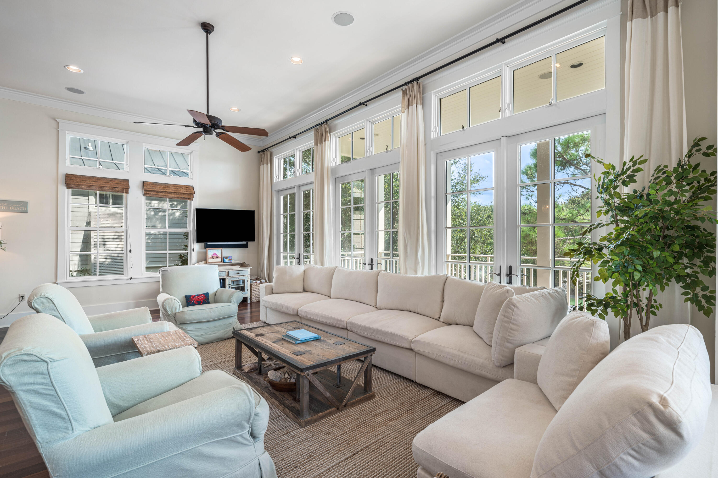 81 Western Lake Drive Santa Rosa Beach, FL 32459 - Photo 15 of 89 a living room with furniture ceiling fan and a large window