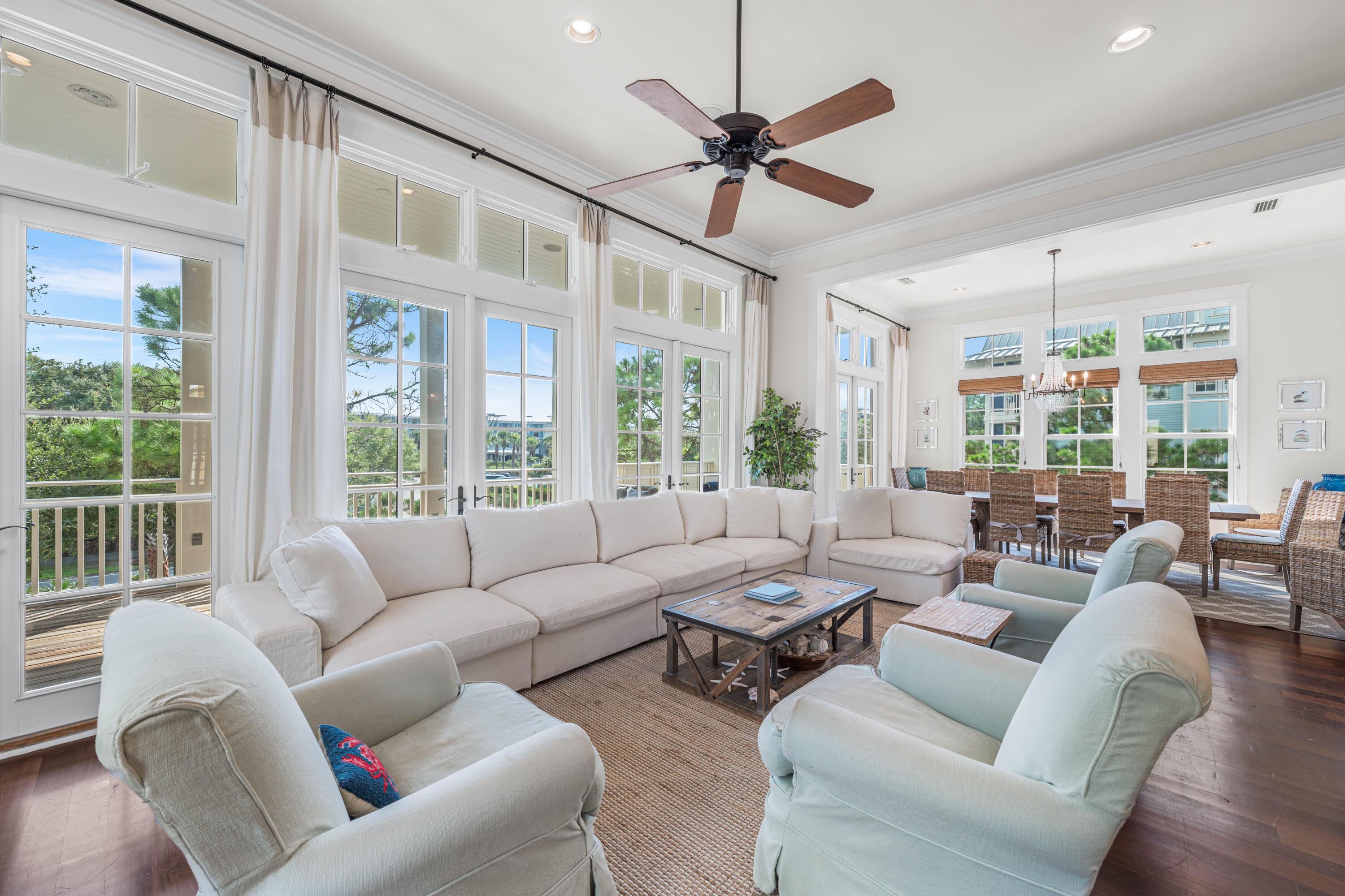 81 Western Lake Drive Santa Rosa Beach, FL 32459 - Photo 16 of 89 a living room with furniture large windows and wooden floor