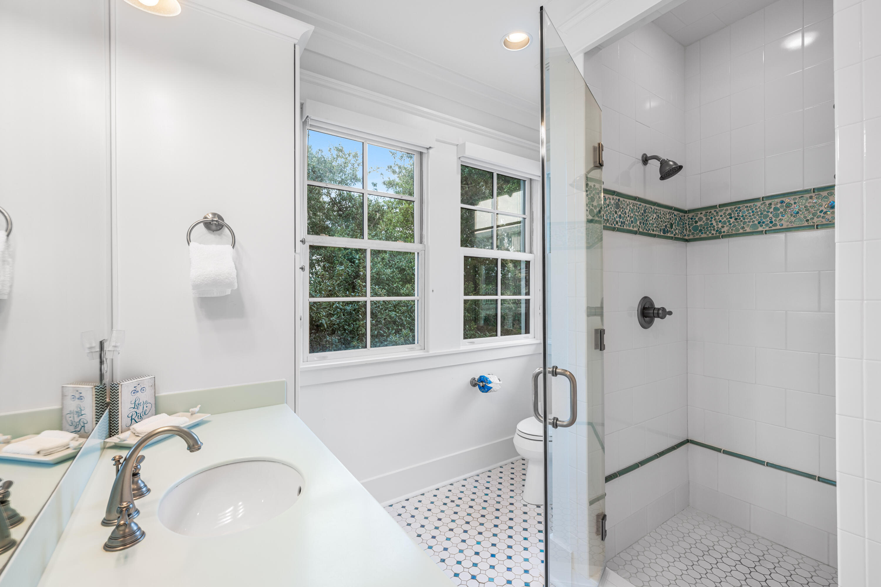 81 Western Lake Drive Santa Rosa Beach, FL 32459 - Photo 71 of 89 a bathroom with a granite countertop sink a mirror and a shower
