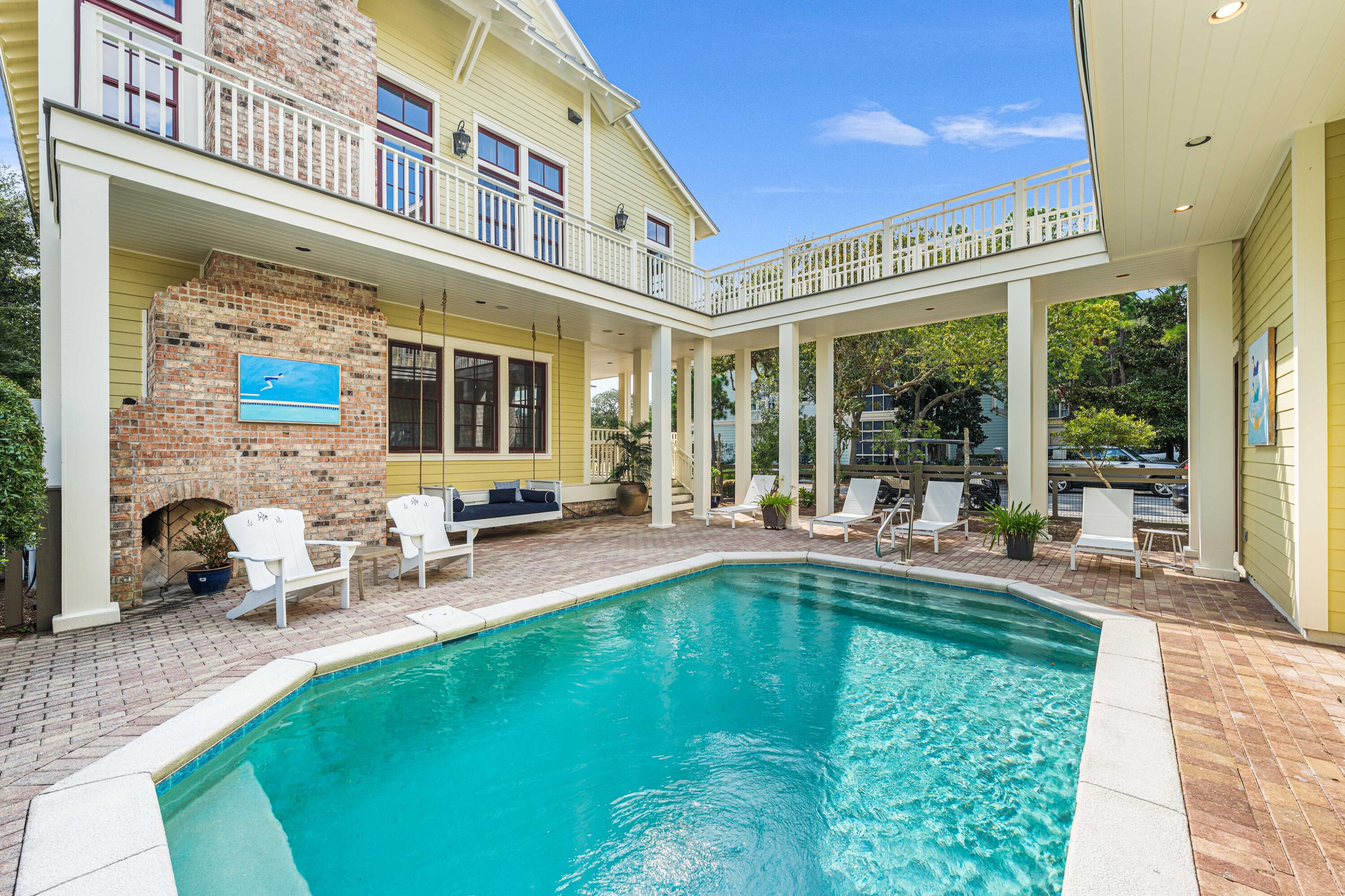 81 Western Lake Drive Santa Rosa Beach, FL 32459 - Photo 75 of 89 a view of a house with swimming pool and sitting area