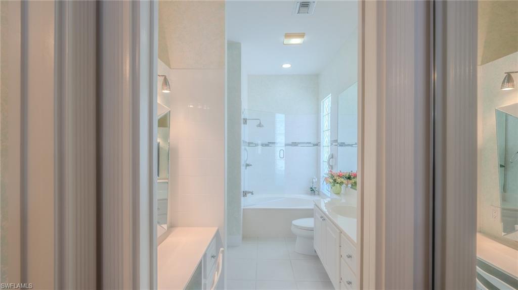 3766 Whidbey Way Naples, FL 34119 - Photo 21 of 50 Full bathroom featuring vanity, light tile patterned floors, and tub / shower combination