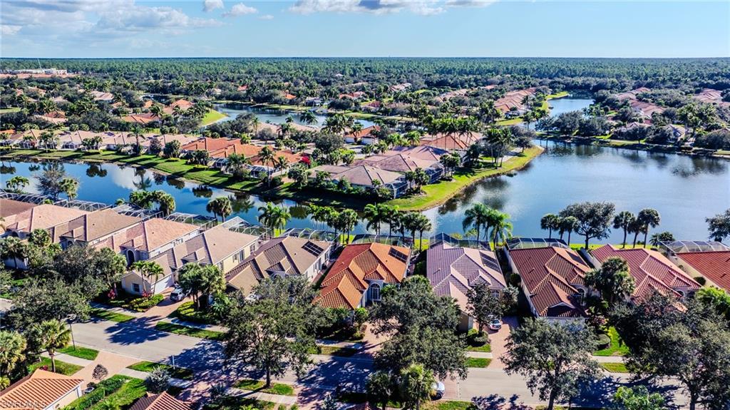 3766 Whidbey Way Naples, FL 34119 - Photo 3 of 50 Aerial view of residential area featuring a large body of water